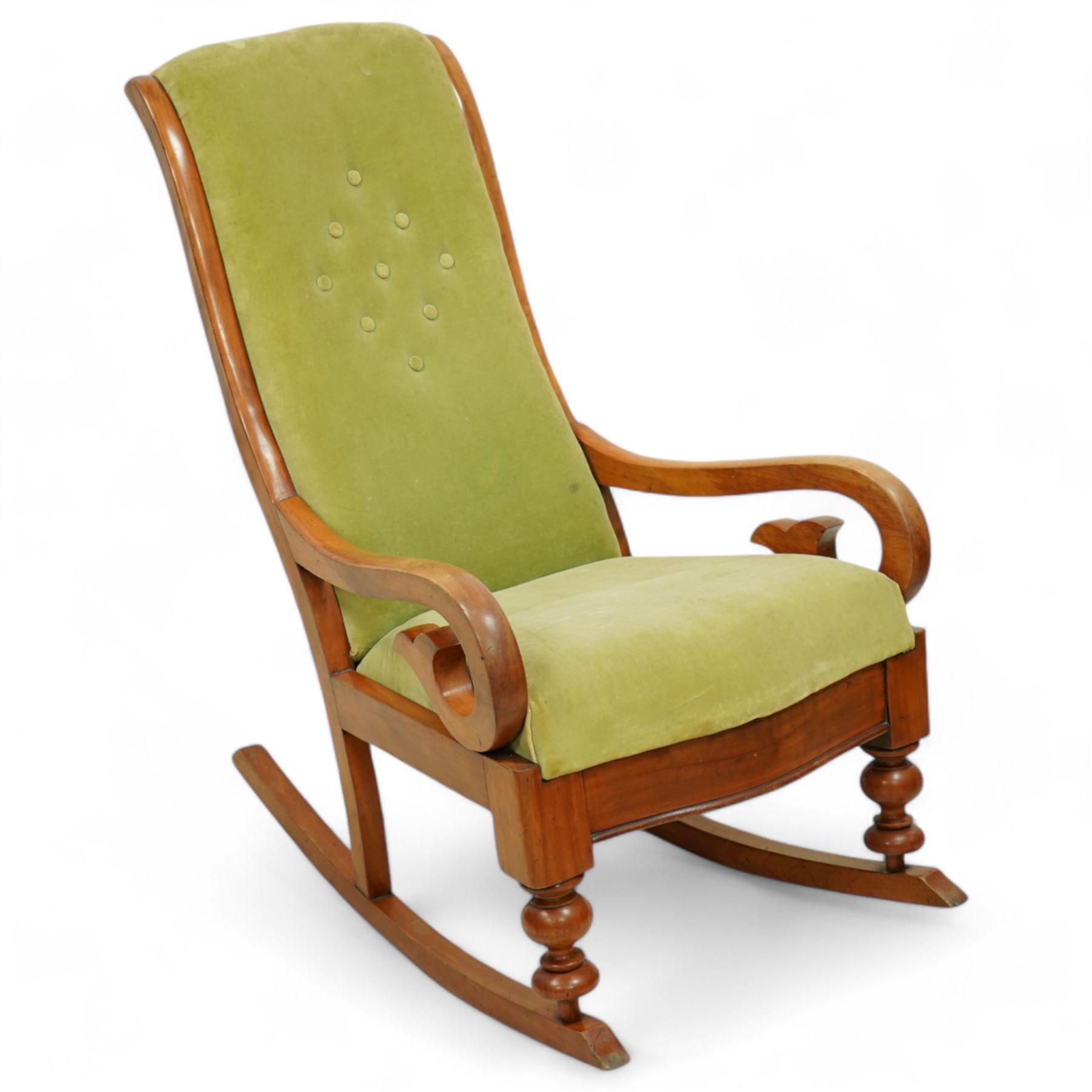 Victorian walnut framed rocking chair, upholstered in sage green buttoned fabric, scrolled arms, on turned front feet with rockers 