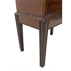 George III figured mahogany cellarette, hinged dome top with false tambour reeded panel enclosing eight bottle divisions, figured front over moulded upper edge, boxwood stringing throughout, on square tapering moulded supports, fitted with brass carrying handles 