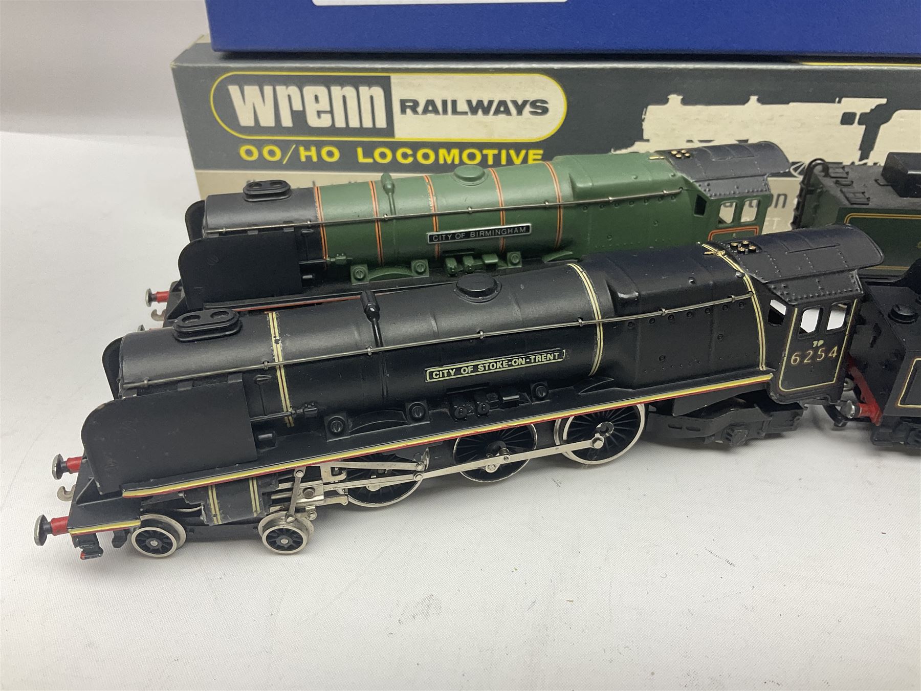 Wrenn '00' gauge - two Princess Coronation (Duchess Class) 4-6-2 locomotives - 'City of Birmingham' No.46235 in BR Green; boxed with tender and instructions; and 'City of Stoke-on-Trent' No.6254 in LMS lined black with associated plain blue box (2)