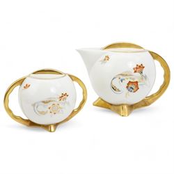 Polish Art Deco style tea service by Cmielow, of globular form with gilt handles and angular splayed feet, comprising teapot, sucrier, milk jug and six cups and saucers, post 1930 printed mark beneath