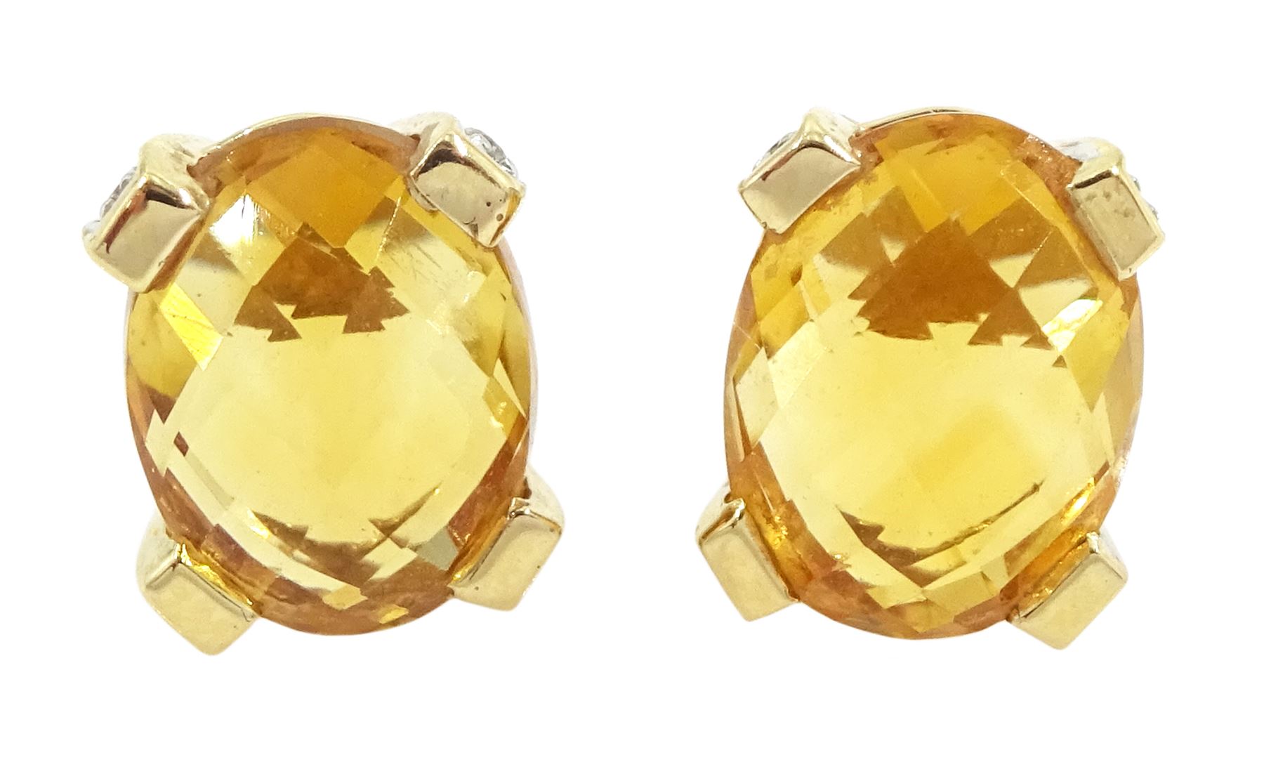 Pair of 14ct gold citrine and diamond stud earrings, oval briolite cut citrines, each claw set with two round brilliant cut diamonds, stamped 585