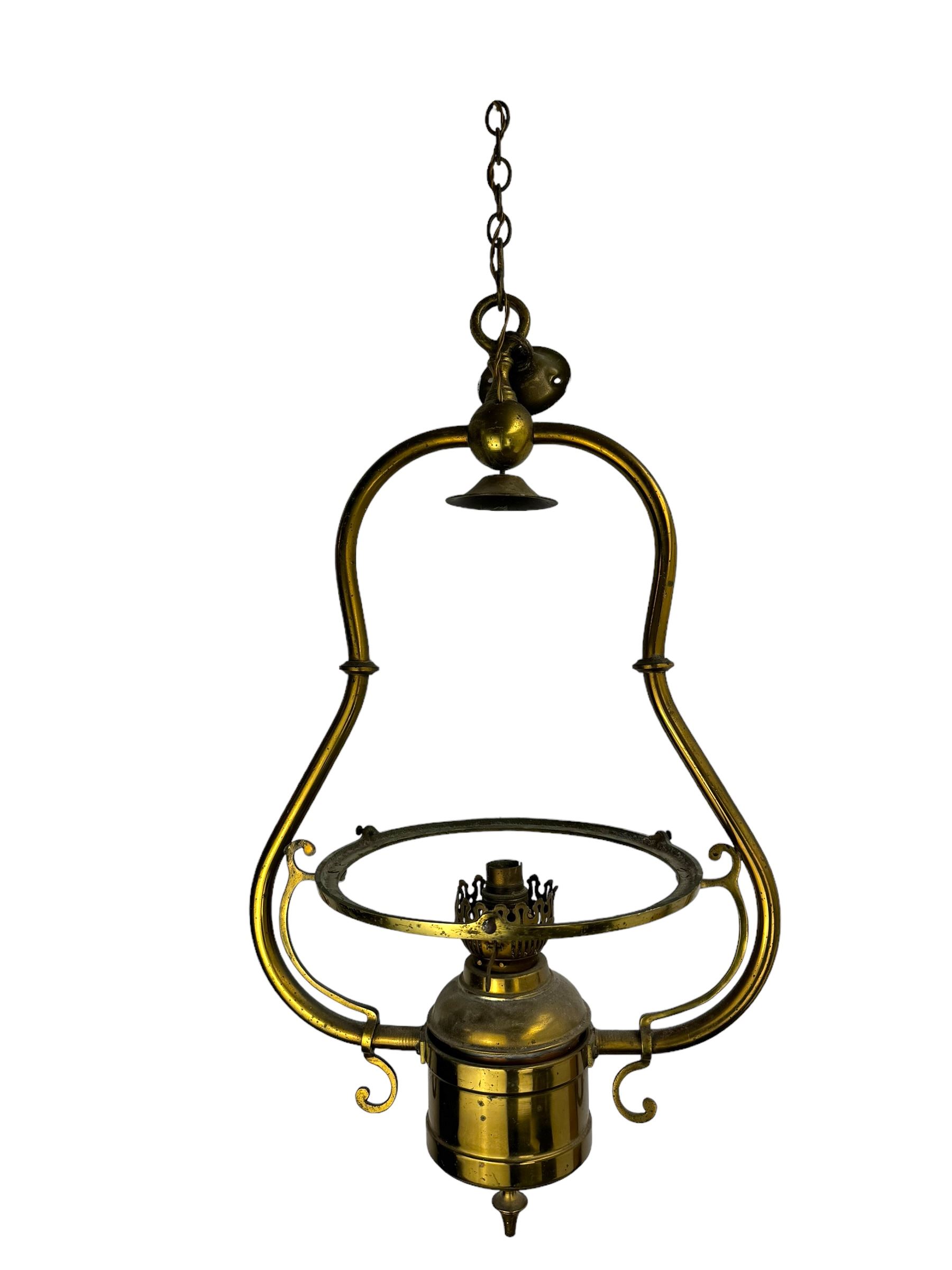 Set three brass framed light fittings, one with white glass shade, converted to electricity, H64cm