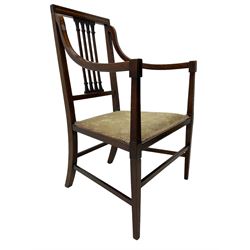 Edwardian satinwood inlaid mahogany elbow chair, the bar back over four vertical rails with foliate and scroll carved decoration, curved and down-swept arms, on square tapering supports united by stretchers 