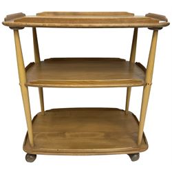 Ercol - mid-20th century light elm 'three tier tea trolley, on castors