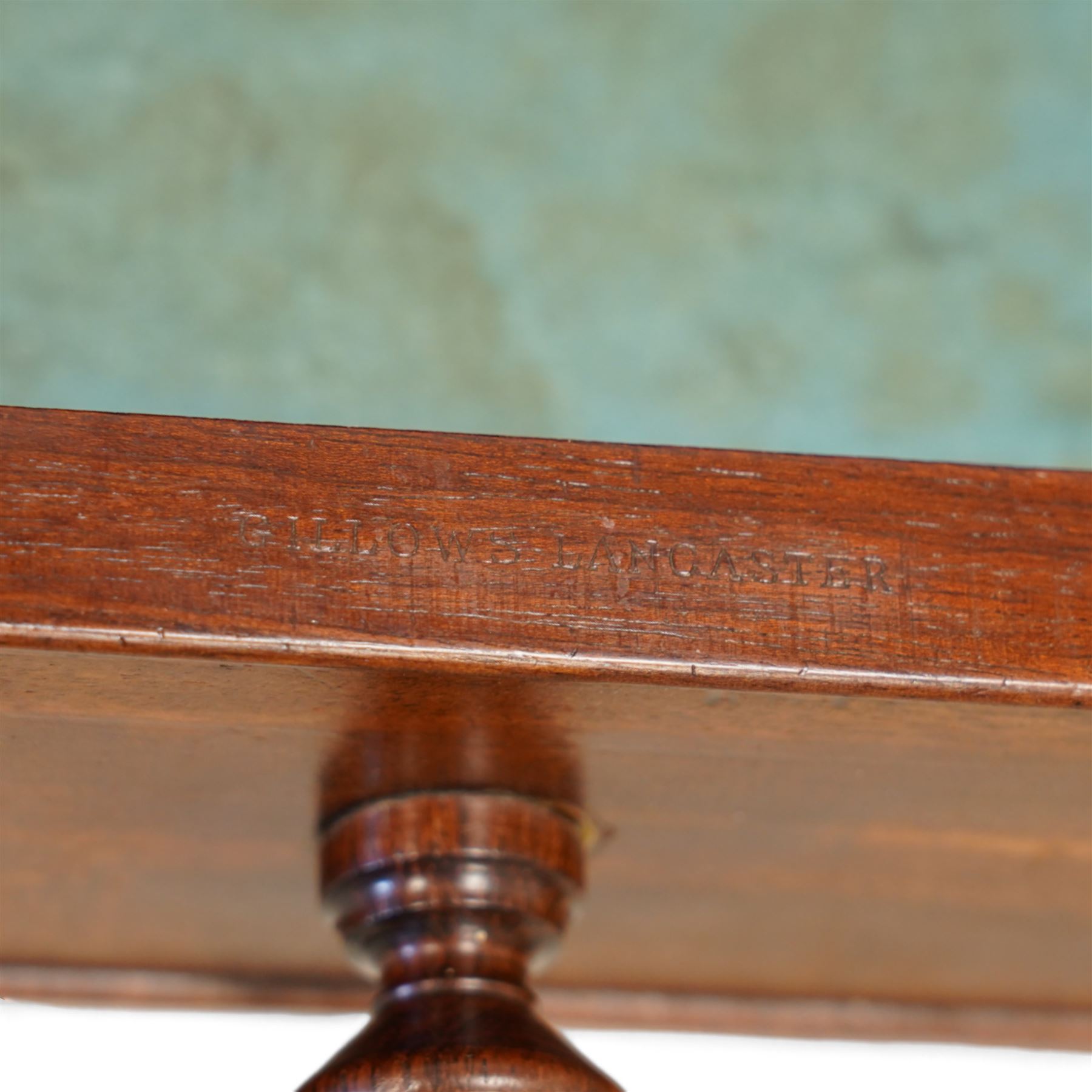 Gillows, Lancaster - early 19th century mahogany writing table, reeded three-quarter gallery over rectangular top with reed moulded edge, fitted with three cocked-beaded drawers with turned handles, the central drawer stamped 'Gillows Lancaster'. on turned supports with brass cups and castors 