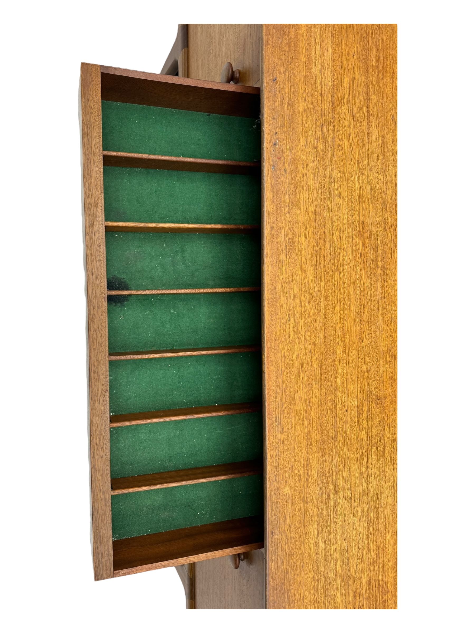 Younger - mid-20th century teak sideboard, rectangular top over three central drawers with recessed handles, flanked by two cupboard doors enclosing two shelves, on tapered supports joined by stretchers