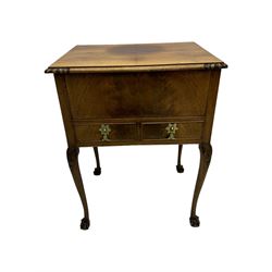 Early 20th century mahogany work table, hinged top enclosing satin-lined compartment with pincushion and pockets, lower section fitted with two drawers with dividers, on cabriole supports with carved knees and claw feet