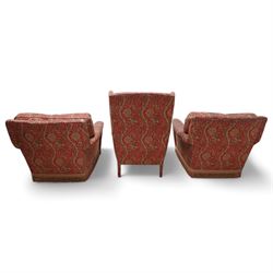 Three-piece lounge suite - pair of armchairs with rolled arms (W85cm, H74cm, D95cm); wingback armchair on cabriole feet (W74cm, H97cm, D73cm), upholstered in crimson ground floral pattern fabric 