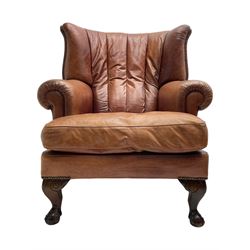 Tetrad - 'Blake' club armchair, fanned wingback and rolled arms upholstered in tan brown leather, on ball and claw carved cabriole feet 