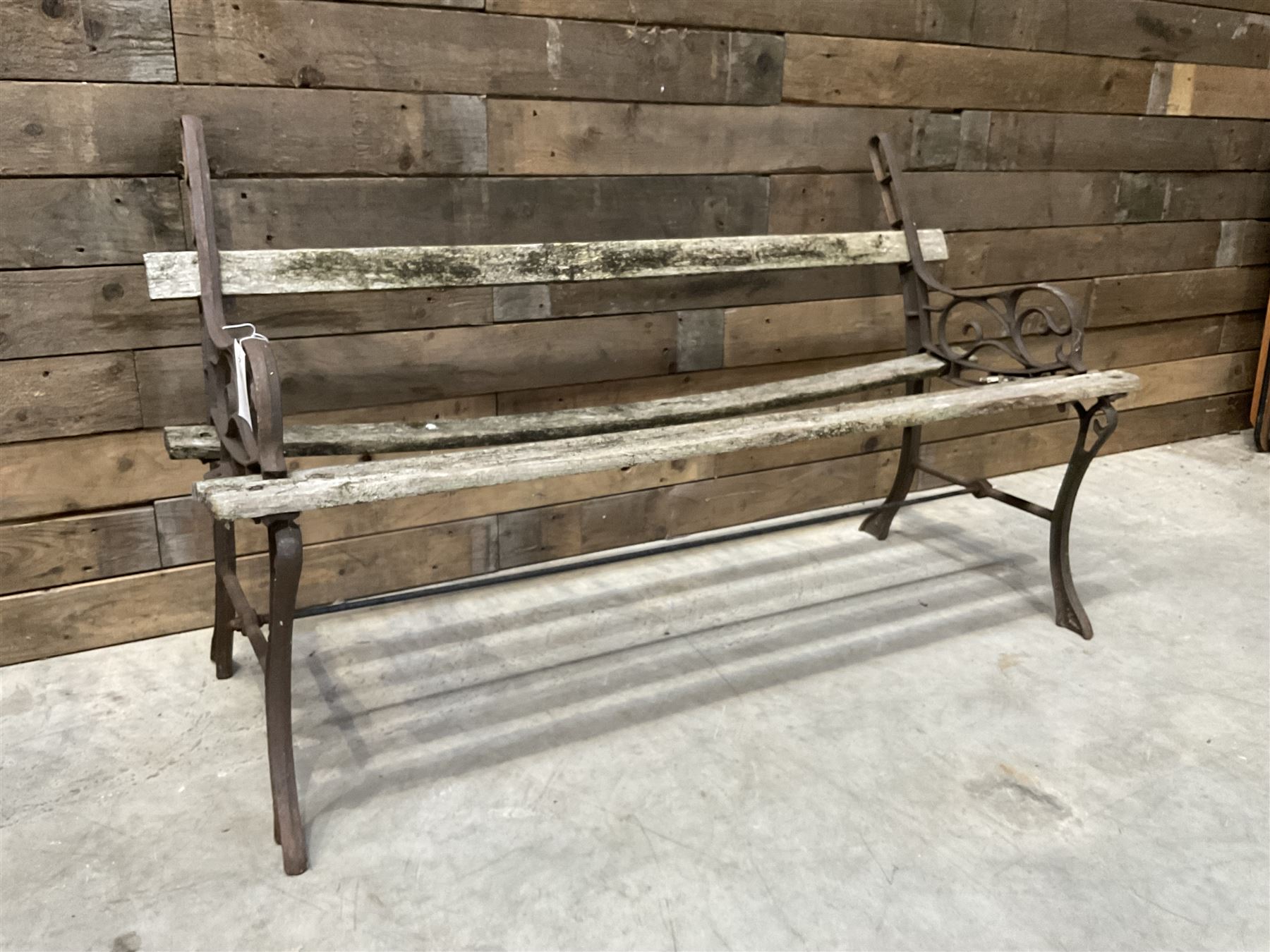 Pair of faux bois cast metal bench ends; together with wooden slatted bench with metal ends