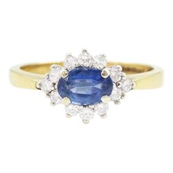 9ct gold oval sapphire and round brilliant cut diamond cluster ring, hallmarked London 1994, sapphire approx 0.55 carat, total diamond weight approx 0.25 carat