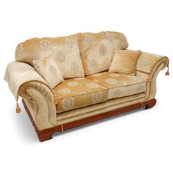 Three-seat sofa (W197cm, D103cm) and pair of matching armchairs (W100cm); upholstered in pale gold fabric decorated with Gul motifs, hardwood framed with polished base