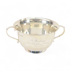 Early 20th century silver twin handled porringer, of typical form with presentation engrav...