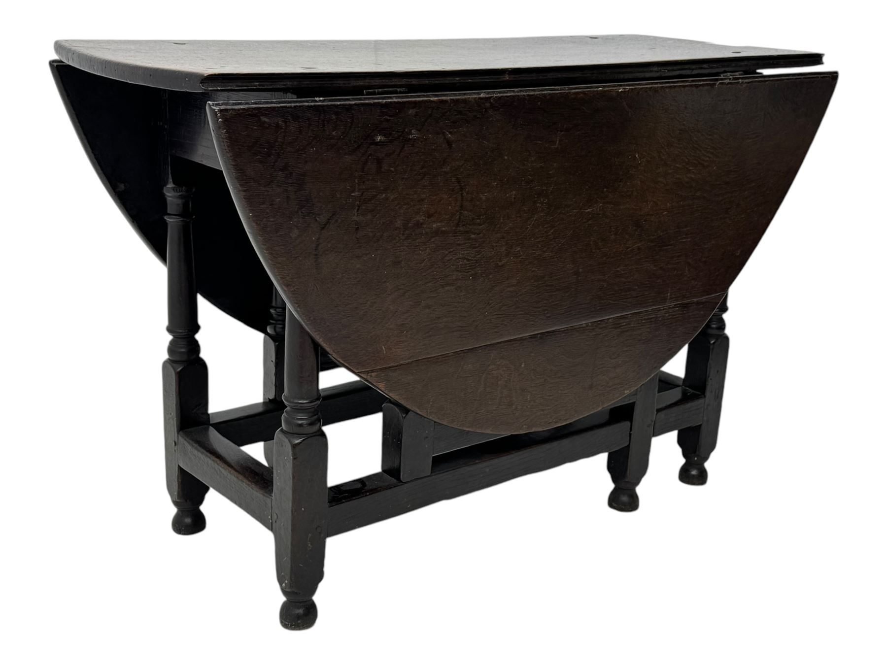 18th century oak dining table, oval drop-leaf top on gate-leg action base, turned supports united by stretchers 