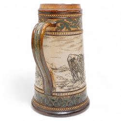 Late 19th century Doulton Lambeth sgraffito jug and beaker by Hannah Barlow, decorated with bands of cattle in landscapes between foliate boarders, with impressed and incised marks beneath, including monogram H24cm (2)