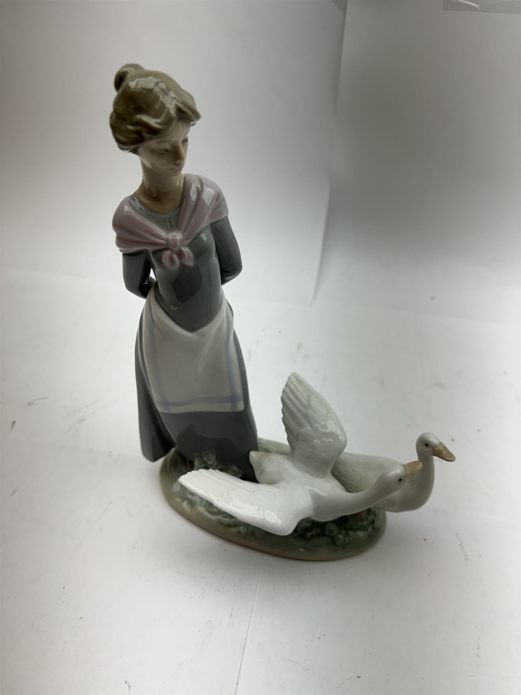 Three Lladro figures, comprising May Dance no 5662, Barnyard Scene no 5659 and Rose Ballet no 5919