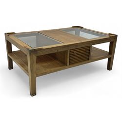 Starbay Tobago cherry wood coffee table, rectangular top with two inset glass panels, central drawer with louvred front and brass handles, flanked by open shelving, raised on square supports with metal corner brackets