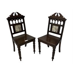 Pair of late Victorian oak hall chairs, shaped pediment over spindle turnings and tiled back, on ring turned supports 