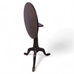 George III mahogany tripod table, circular tilt-top on ring turned gun barrel pedestal, on three out-splayed supports 