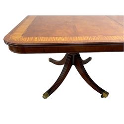 RBC Furniture (Made in England) - Georgian design mahogany dining table, rectangular top with rounded corners, satinwood and burr walnut bandings, two D-ends with two additional leaves and support rails, on barrel turned pedestals with four out-splayed reeded supports, brass cups and castors 