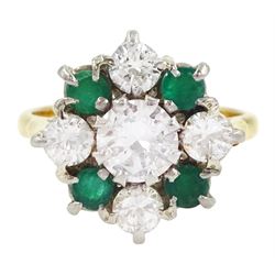 18ct gold emerald and diamond cluster ring, the central round brilliant cut diamond of approx 0.80 carat, with four stone round cut emerald and four stone round brilliant cut diamond surround, Sheffield 1977, total diamond weight approx 1.70 carat