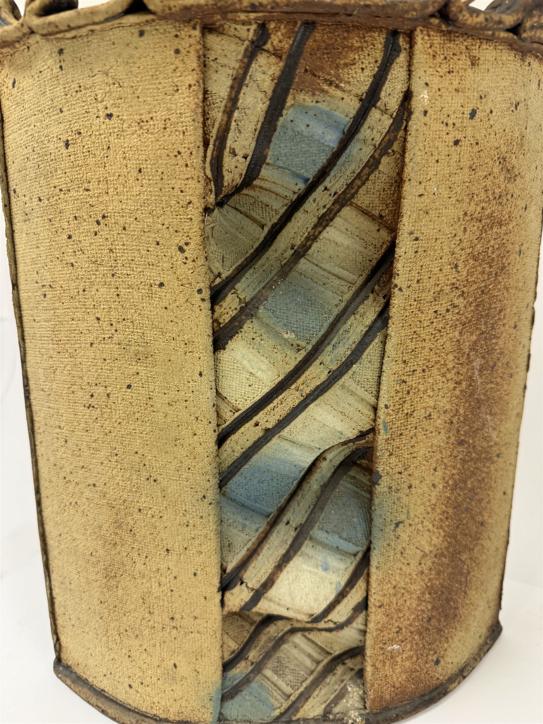 Jim Robison (American 1939-): slab built sculptural stoneware vase, of navette form with textured fabric effect decoration to centre, signed beneath, H35cm