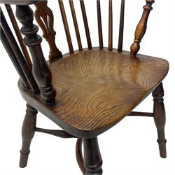 19th century yew wood and elm Windsor armchair, low double hoop stick and pierced splat back, dished seat on turned supports united by crinoline stretchers