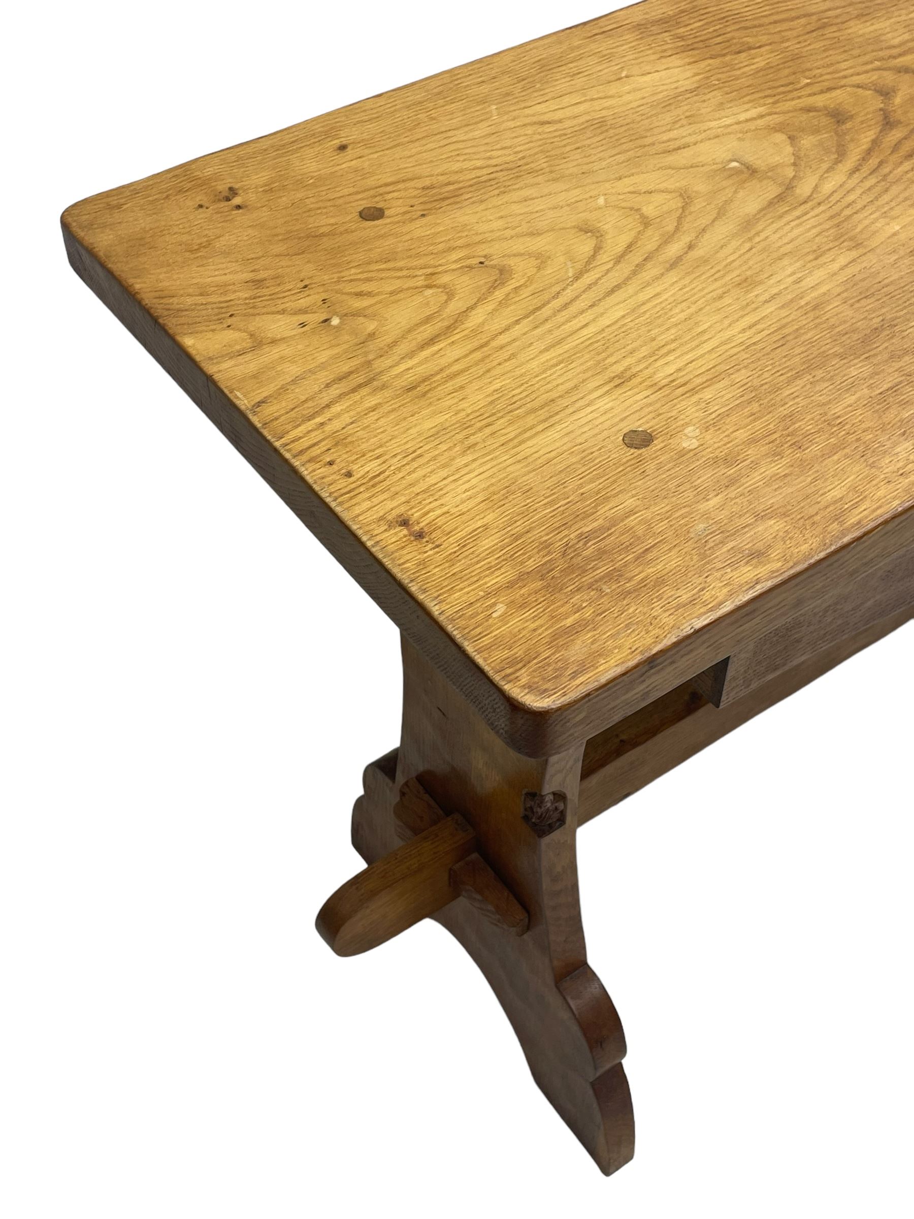 Gnomeman - oak side table, rectangular adzed top over two drawers, on shaped end end supports united by pegged stretcher, carved with gnome signature, by Thomas Whittaker, Littlebeck 