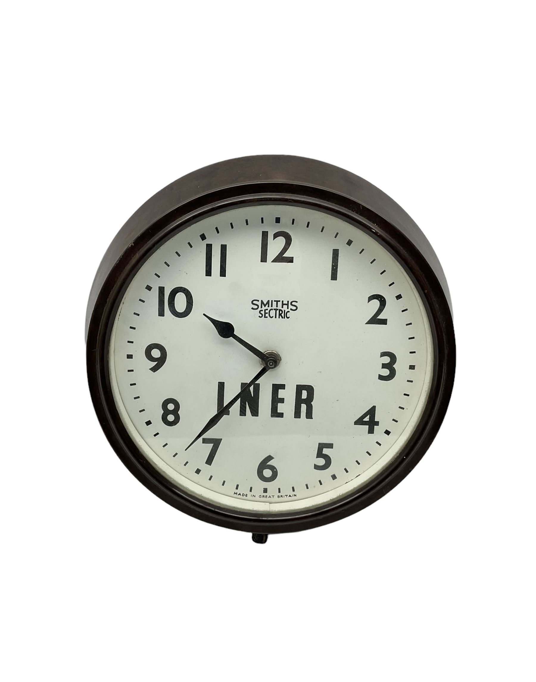 Smiths - Two 1950's Smiths mains operated Sectric clocks in Bakelite cases. Circular office wall clock with Arabic numerals and spade hands inscribed LNER. Ivory Bakelite cased mantle clock with alarm and repeat function.