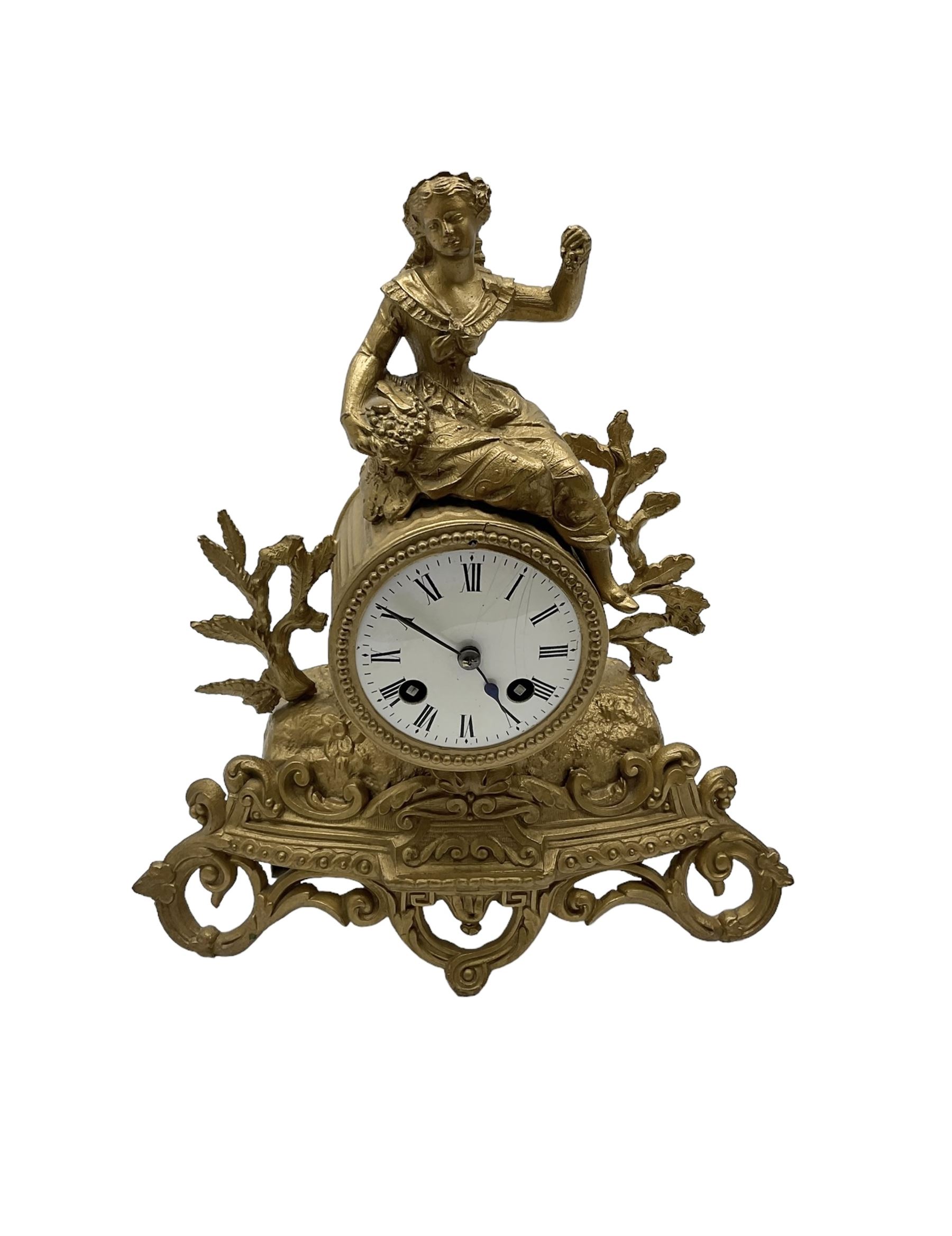 French - late 19th century 8-day mantle clock, in a spelter case with a solitary maiden seated above the drum movement, with an enamel dial, Roman numerals, minute markers and spade hands, twin train countwheel striking movement striking the hours and half hours on a bell. With pendulum and key. 