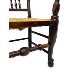 Matched set of twelve 19th century elm Lancashire spindleback dining chairs, shaped cresting rail over spindle back, rush seat, on turned supports united by turned stretchers, ring and globular turned front stretcher 