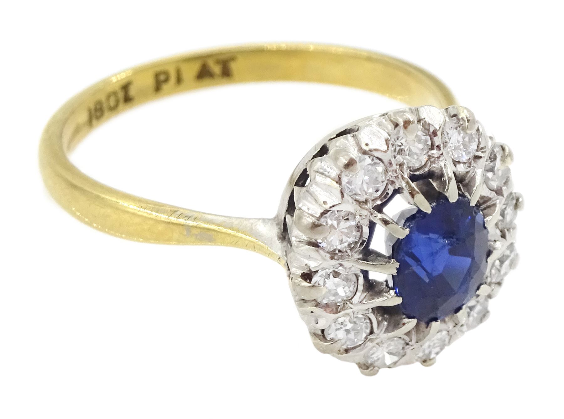 Gold oval cut sapphire and round brilliant cut diamond cluster ring, stamped 18ct Plat, sapphire approx 0.85 carat, total diamond weight approx 0.35 carat