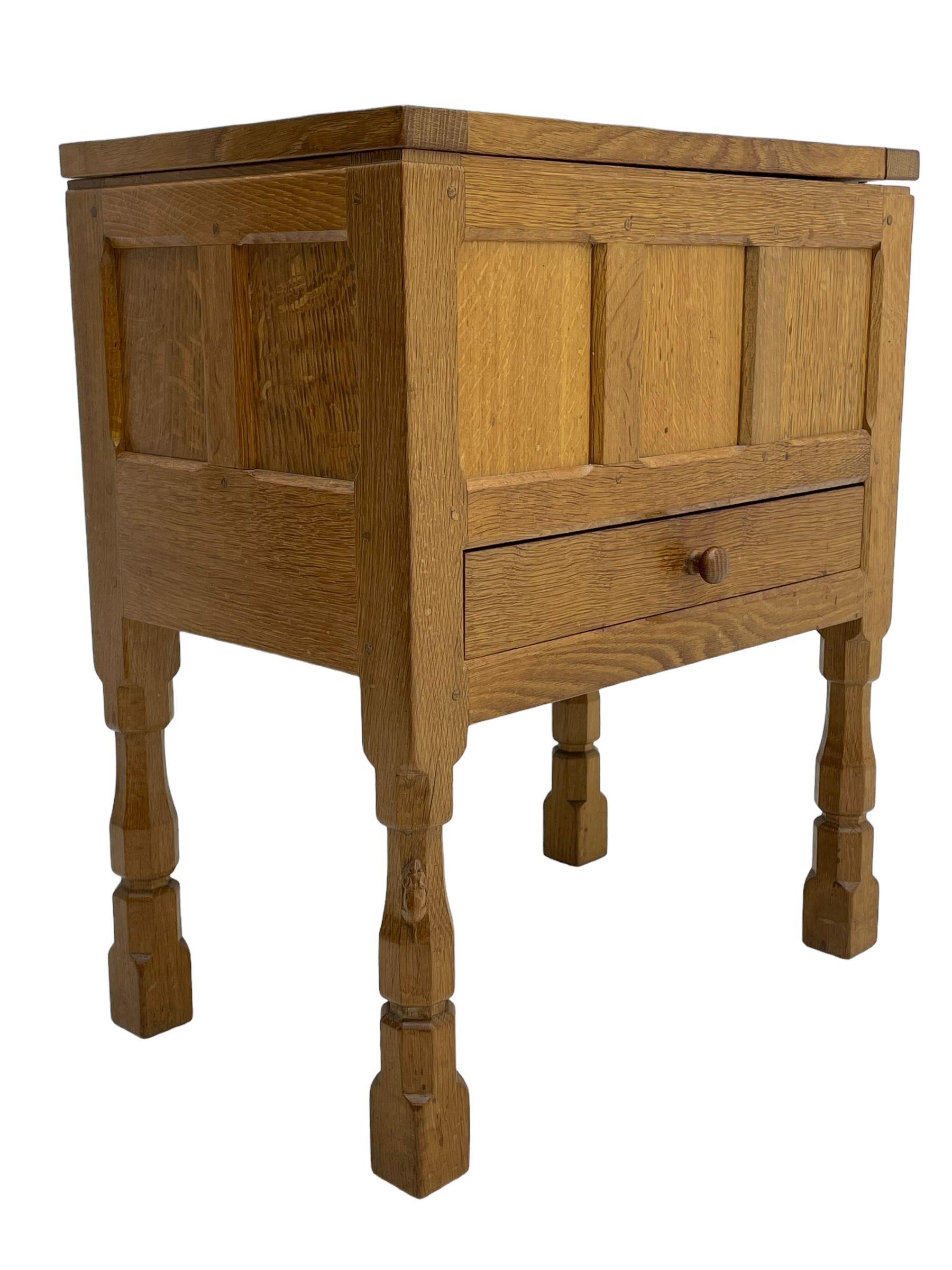 Mouseman - oak work or sewing box, rectangular adzed top inscribed 'L. M. C. 1976' enclosing vacant interior, triple panelled front and double panelled sides, fitted with single drawer, on octagonal supports, carved with mouse signature, by the workshop of Robert Thompson, Kilburn 