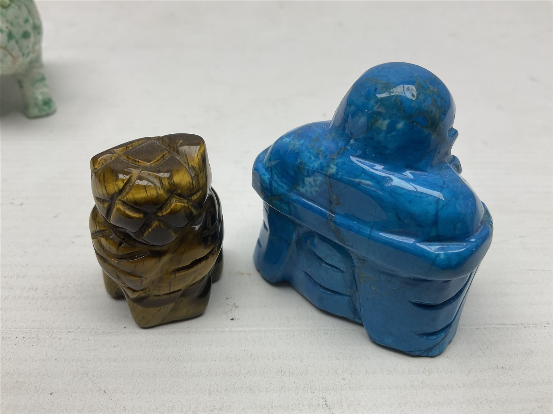 Carved Lapis lazuli figure in the form of Ganesha, together with turquoise carved buddha, tigers eye owl and other carved figures and plaques, Ganesha 8cm