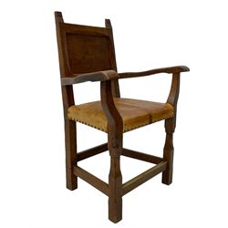 Gnomeman - set of eight (6+2) oak dining chairs, adzed panelled back over tan leather upholstered seat with applied stud band, on square supports united by plain stretchers, each chair carved with gnome signature, by Thomas Whittaker, Littlebeck, Whitby