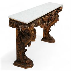 Early 20th century Baroque design ornate giltwood console table with rectangular marble top, the heavily moulded protruding and pierced frieze decorated with a central crowned foliage cluster with extending scrolling acanthus leaves, the shaped end supports decorated with further moulded gilt foliate scrolls interspersed with flower heads, on shaped stepped bases carved with floral patterns 