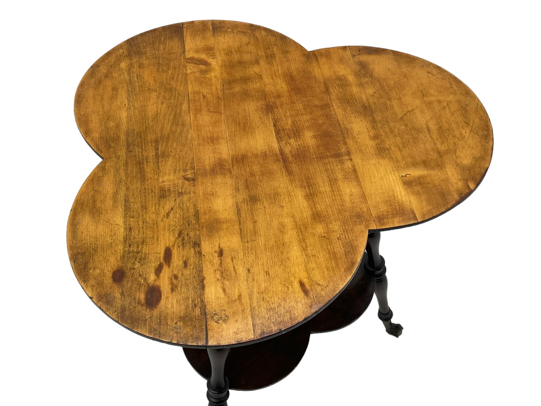 Late 19th to early 20th century stained beech 'Gypsy' table, trefoil or clover shaped top on turned supports united by undertier, on cast metal and glass ball feet 