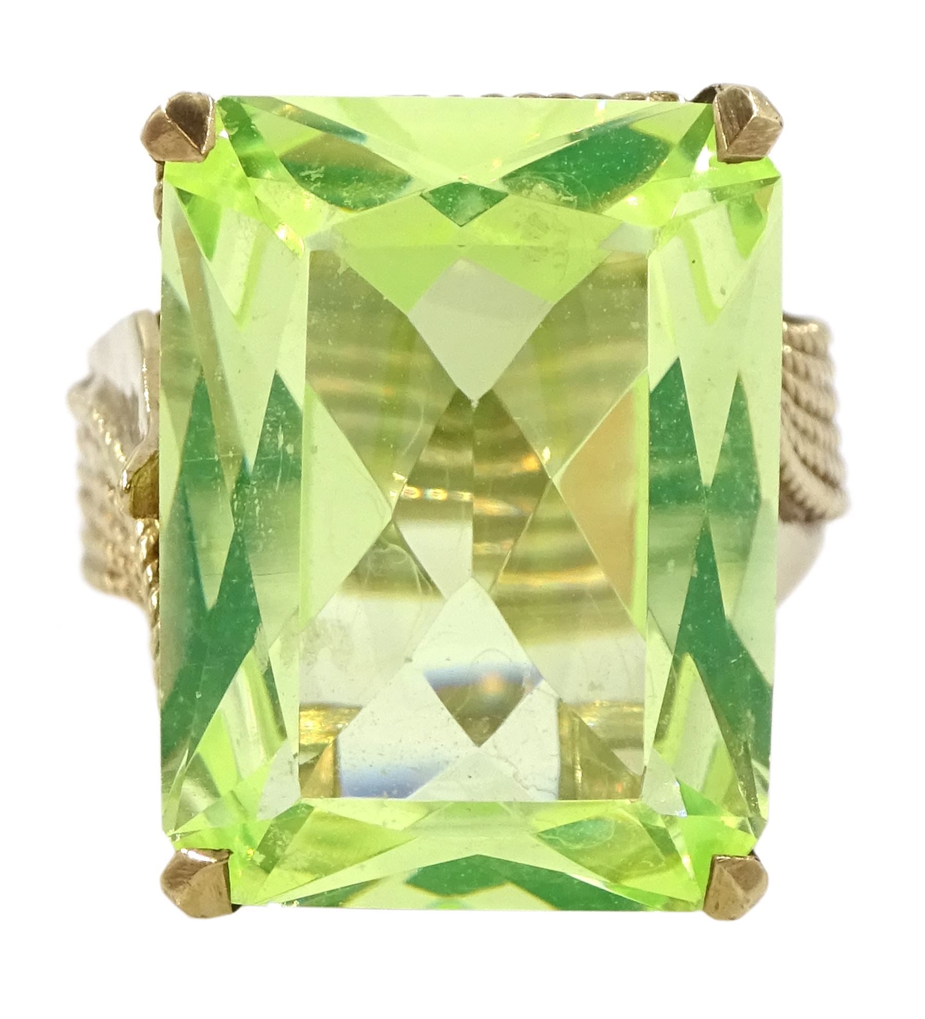 Gold large green stone set dress ring, with twist rope design shank, stamped 9ct