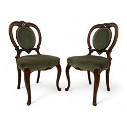 Pair of Victorian mahogany salon chairs, carved and pierced cameo back with scrolling acanthus leaf decoration and c-scrolls, upholstered in sage green fabric, on cabriole supports with floral mouldings