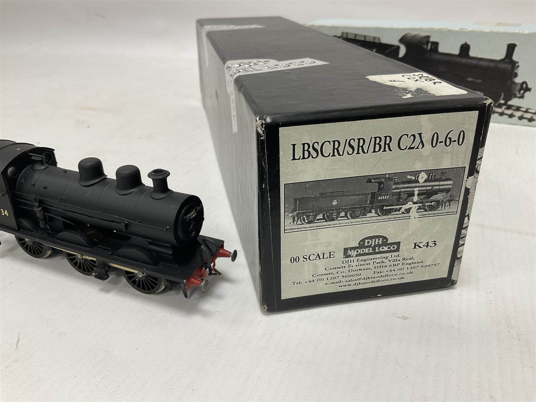 ‘00’ gauge - two kit built steam locomotive and tenders comprising Class 0395 Jumbos 0-6-0 no.30566 finished in BR black; Class C2X Large Vulcans 0-6-0 no.32434 finished in BR black; both with DJH Models boxes (2) 