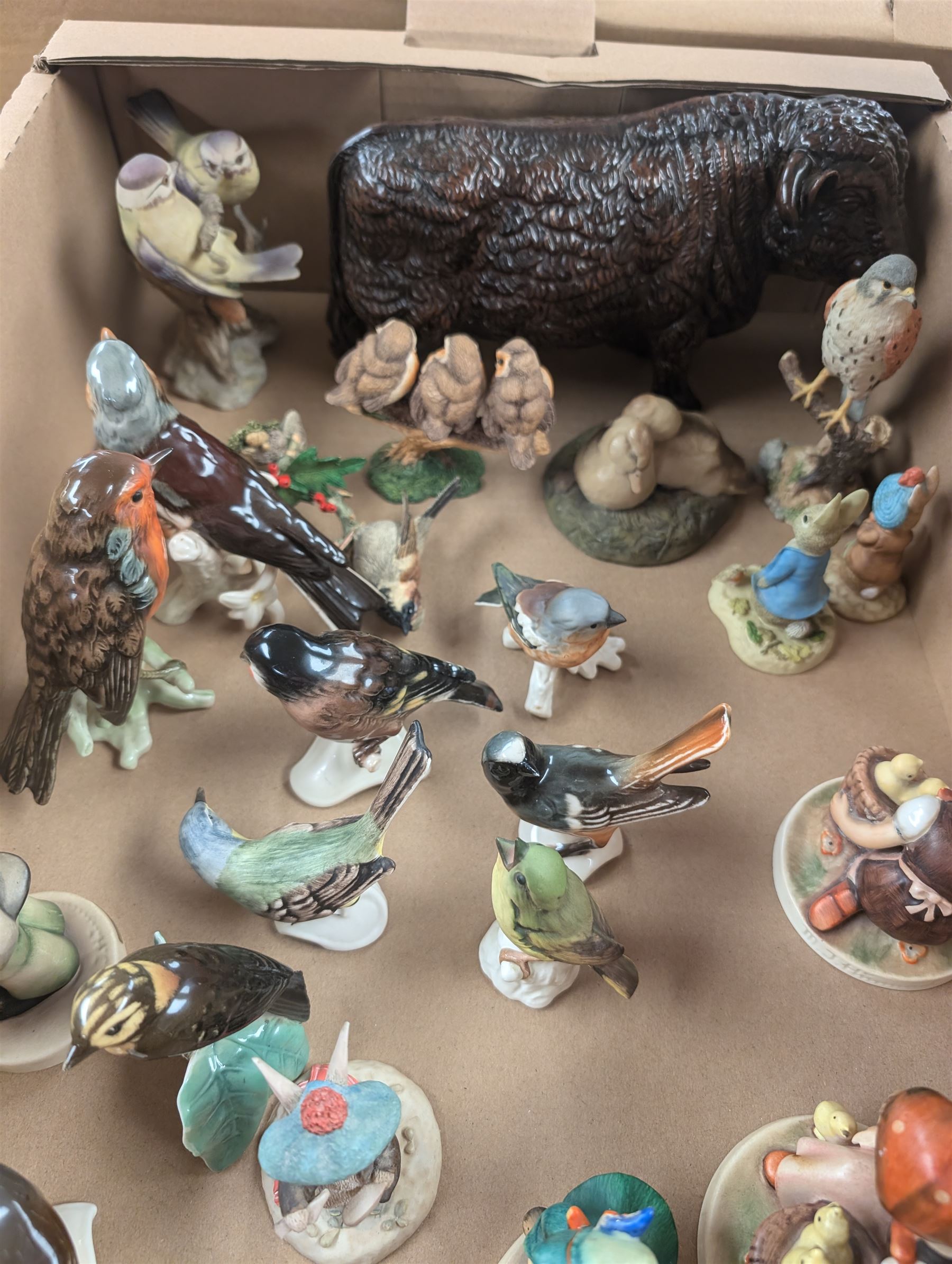 Collection of bird and animal figurines, including Goebel and Country Artists examples