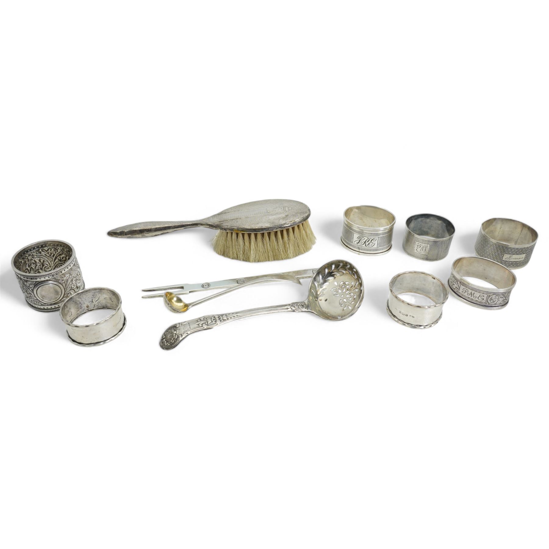 George IV silver sifting spoon London 1828 Maker John, Henry and Charles Lias, eight various serviette rings and three other silver items