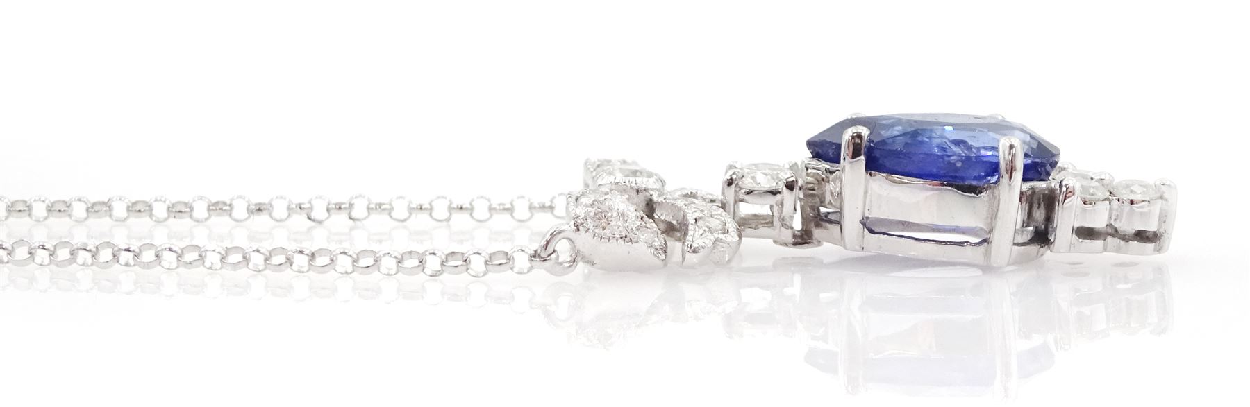 18ct white gold sapphire and diamond pendant necklace, the round brilliant cut diamond bow, suspending a pear cut sapphire and four round brilliant cut diamonds, stamped 750, sapphire approx 3.80 carat, total diamond weight approx 0.45 carat