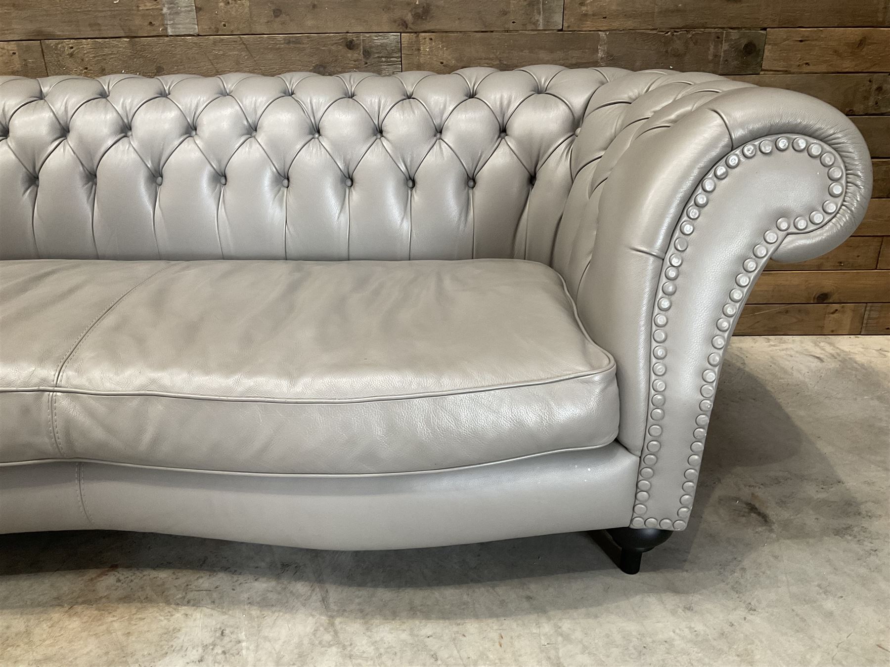 Three seat Chesterfield sofa, upholstered in grey buttoned leather