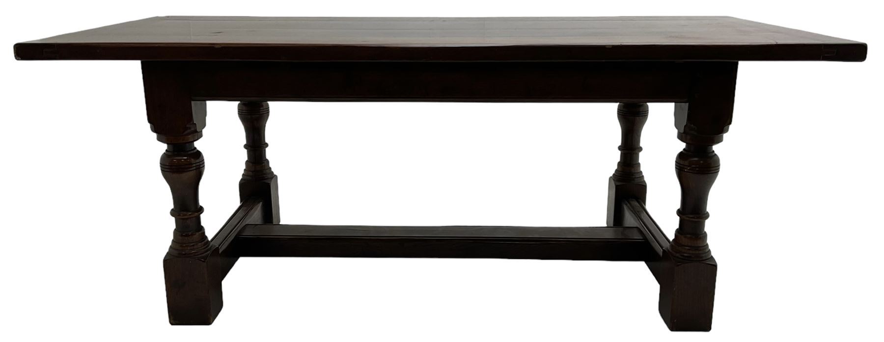 20th century oak refectory dining table, rectangular cleated top on turned supports joined by H-stretcher