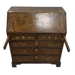 18th century walnut bureau, crossbanded and feather-banded rectangular top and fall-front, enclosing fitted interior with pigeonholes and correspondence drawers with bone handles, over two short and three long graduating drawers with moulded facias and original brass handles, on bracket feet