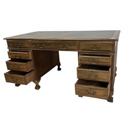 Georgian design twin pedestal desk, rectangular top with green leather inset, fitted with nine drawers, on cabriole supports with ball and claw feet 