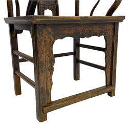 Chinese design elm yoke back 'official's' armchair, the shaped cresting rail over splat decorated with carved and pierced wildlife scenes, shaped projecting arms over rectangular seat, square supports united by plain stretchers, decorated with shaped frame brackets carved with foliage