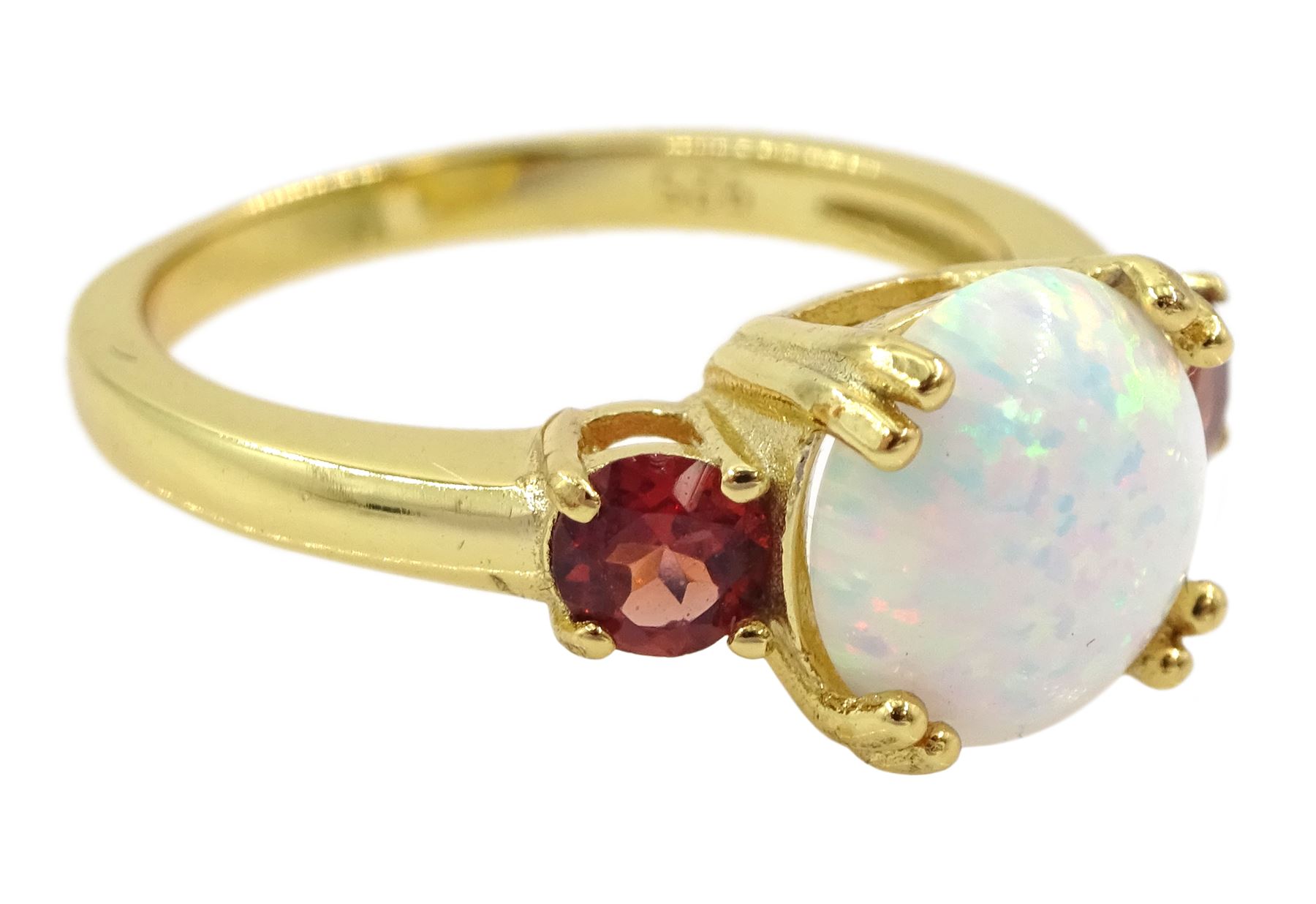 Silver-gilt three stone opal and garnet ring, stamped 925