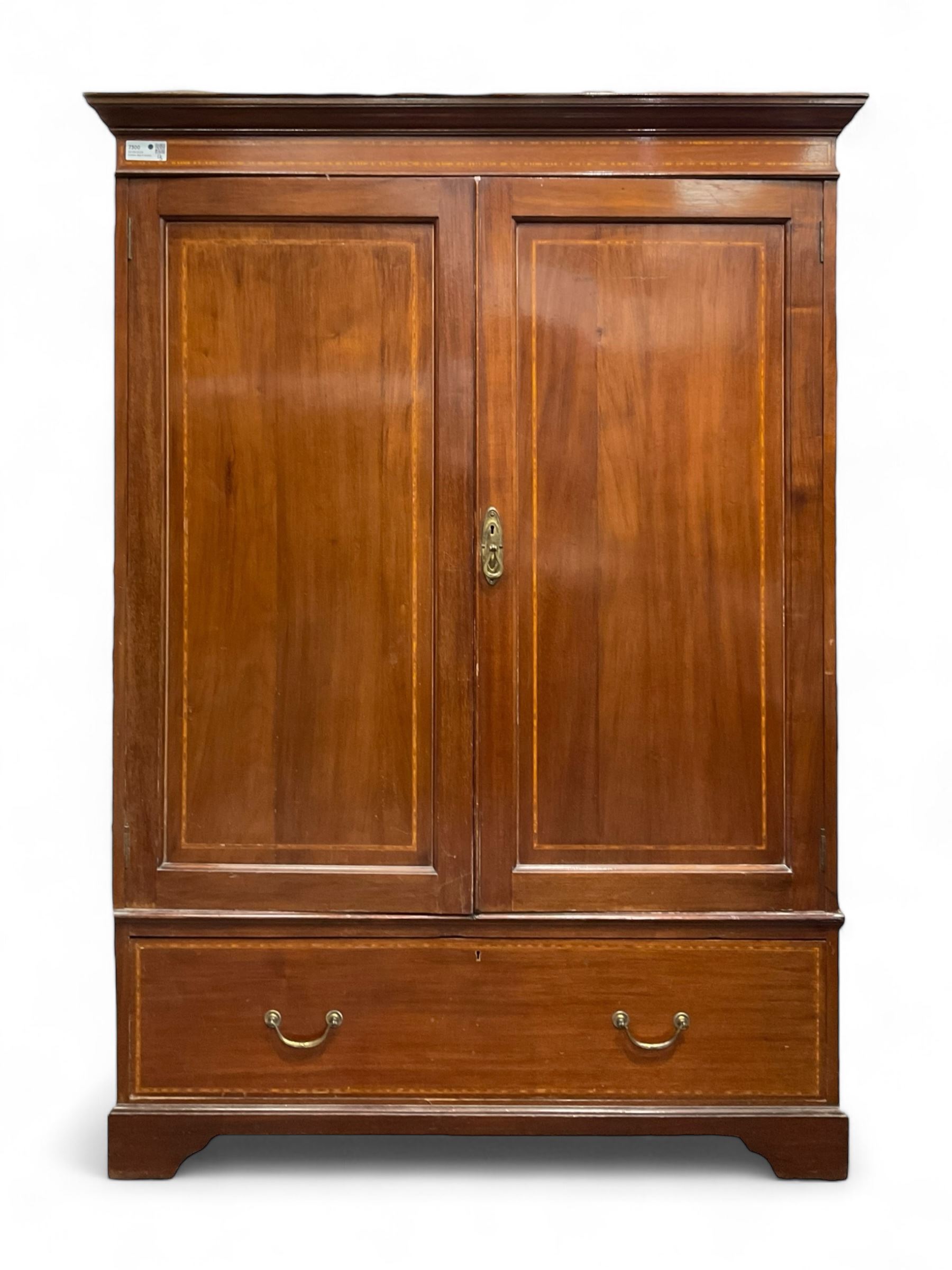 Edwardian inlaid mahogany double wardrobe, panelled doors enclosing sliding trays and hanging rail, fitted with single drawer to base